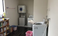 洗濯機スペース。基本的には介護保険にて施設スタッフが使用。ご家族の方も使用できます。